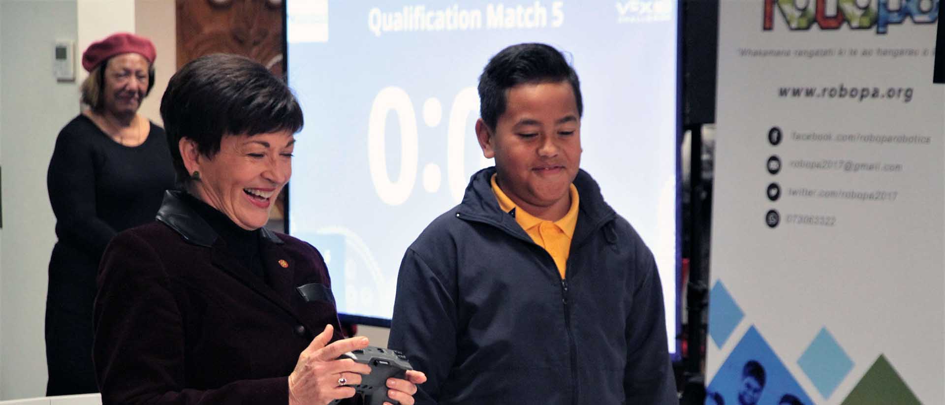 Dame Patsy Reddy tries her hand at robot scrimmage